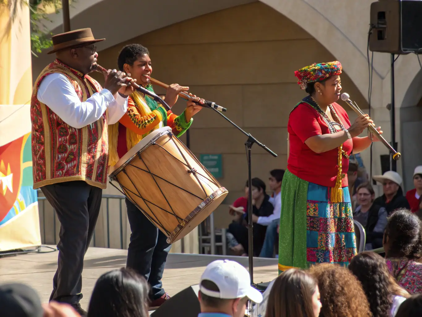A vibrant scene from a FEST'IRLANDE event, featuring musicians playing traditional Irish instruments like fiddles and bodhráns, with dancers performing lively jigs and reels in colorful costumes. The atmosphere is joyful and celebratory, capturing the essence of Irish culture.